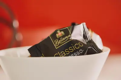 a piece of chocolate in a white bowl at Modern and Cozy Apartment in the centre of Athens in Athens