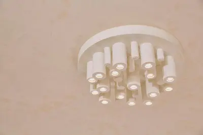 a cluster of white lights hanging on a wall at Modern and Cozy Apartment in the centre of Athens in Athens