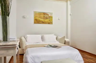 a white room with a bed and a couch at Modern and Cozy Apartment in the centre of Athens in Athens