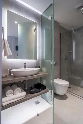 a bathroom with a sink and a toilet and a shower at Acropolis Stay in Athens