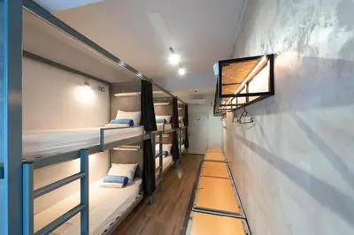 a group of bunk beds in a room at Bedbox Hostel in Athens