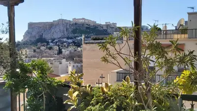 a view of the acropolis from the city of athens at Omiros Hotel in Athens
