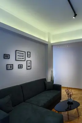 a living room with a couch and a table at Modern design apartment near Acropolis in Athens