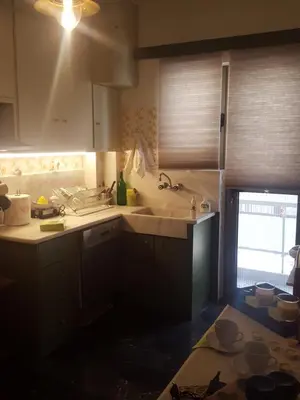 a kitchen with a sink and a counter top at Superb Athenian Nest in Athens