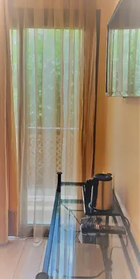 a kitchen with a stove and a window at Olympic Fashion Hotels in Athens