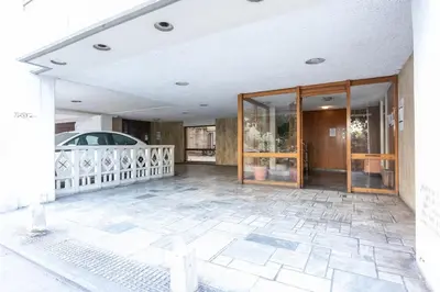 a large room with glass doors on a building at Stadium 1bdr HiEnd quiet Flat Top Location in Athens