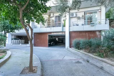 a building with a balcony and a driveway at Stadium 1bdr HiEnd quiet Flat Top Location in Athens