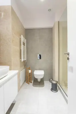 a bathroom with a toilet and a sink and a shower at Stadium 1bdr HiEnd quiet Flat Top Location in Athens