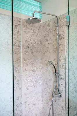 a shower in a bathroom with a shower curtain at Mind-blowing Acropolis View Apt in Athens