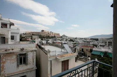 a view of the city from a balcony at Mind-blowing Acropolis View Apt in Athens