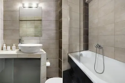a bathroom with a tub and a sink and a toilet at Vouliagmeni Stylish Homes by BluPine in Athens