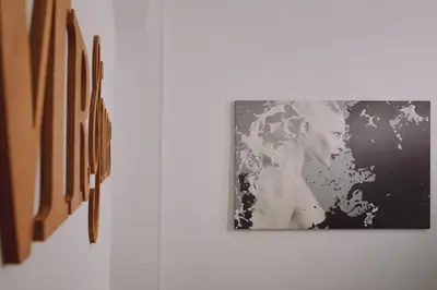 a black and white picture of a woman on a wall at Luxury apartment central in Athens