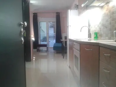 a kitchen with a sink and a counter at Super 36sqm Junior Suite in luxurious picturesque area in Piraeus