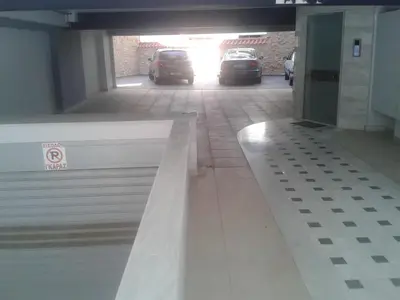 a garage with two cars parked in a parking lot at Super 36sqm Junior Suite in luxurious picturesque area in Piraeus
