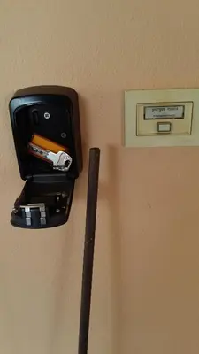 a black holder with a pen and a baseball bat at Athenian apartment with garden, near metro station Chalandri Nu 3 in Athens