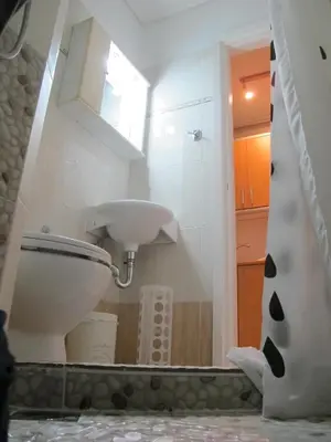 a bathroom with a toilet and a sink at Athenian apartment with garden, near metro station Chalandri Nu 3 in Athens