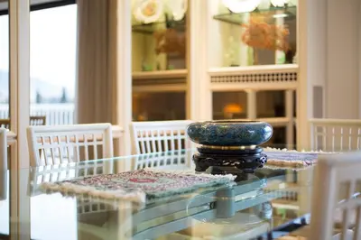a glass table with a vase on top of it at Alexander's Penthouse in Athens