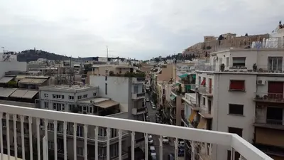 a view of a city from the balcony of a building at Alexander's Penthouse in Athens