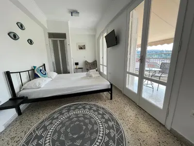 a bedroom with a bed and a balcony at Safestay Athens Monastiraki in Athens