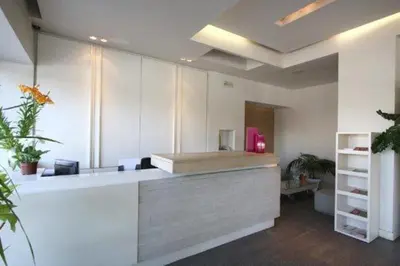 an office with a reception desk with a counter at Ariston Hotel in Athens