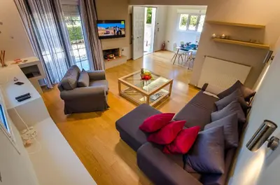 an overhead view of a living room with a couch and chairs at Aquarius - Glyfada detached house in Athens