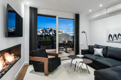a living room with a couch and a fireplace at Executive 2 bdr Suite in Plaka - Acropolis view in Athens