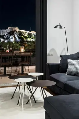 a living room with two tables and a couch at Executive 2 bdr Suite in Plaka - Acropolis view in Athens