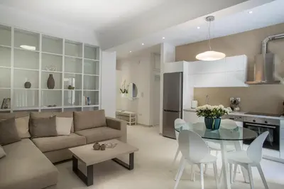 a living room with a couch and a table at Acropolis Museum - Modern Living [I] in Athens