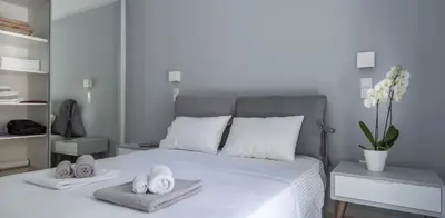 a bedroom with a bed with towels on it at Acropolis Museum - Modern Living [I] in Athens