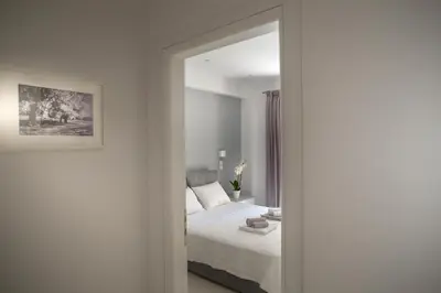 a bedroom with a bed and a mirror at Acropolis Museum - Modern Living [I] in Athens