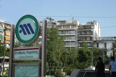 a sign for a hyundaiundaiundaiennis station in front of a building at Socrates Hotel in Athens