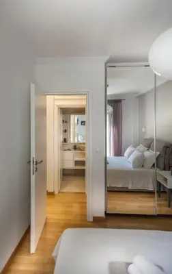 a bedroom with a bed and a mirror at Acropolis Museum - Modern Living [II] in Athens
