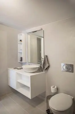 a white bathroom with a sink and a toilet at Acropolis Museum - Modern Living [II] in Athens