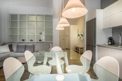a living room with a glass table and white chairs at Acropolis Museum - Modern Living [II] in Athens