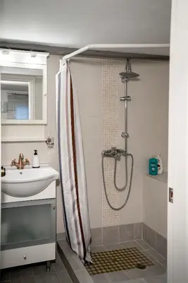 a bathroom with a shower and a sink at Valashouse in Athens