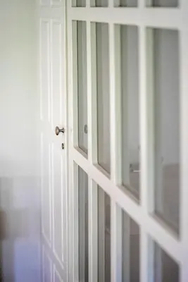 an open door with a striped wall at Valashouse in Athens