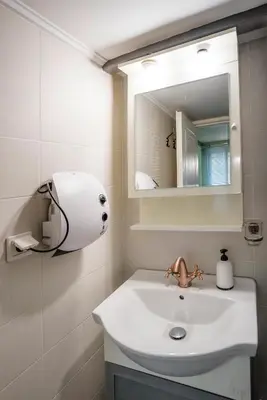 a bathroom with a sink and a mirror at Valashouse in Athens