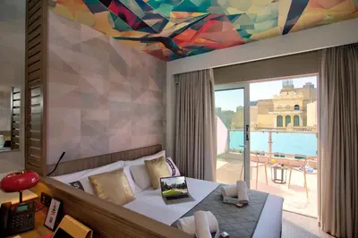 a bedroom with a bed and a colorful ceiling at Casual Kubic Athens in Athens