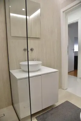 a bathroom with a white sink and a mirror at Perfect athens in Athens