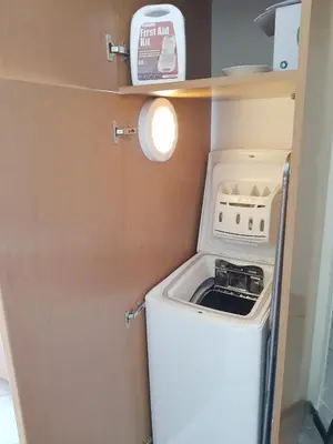a washer and dryer in a small room at Sounio Palea Heaven in Palaiá Fókaia
