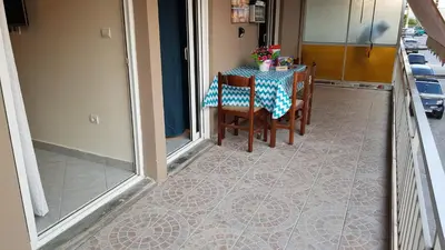 a table with chairs and a blue and white table cloth at Sounio Palea Heaven in Palaiá Fókaia
