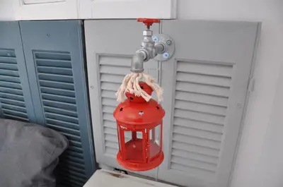 a red fire hydrant hanging from a wall at Your Home in Athens