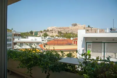 a view of a city from a balcony of a building at Unique Acropolis View in Athens
