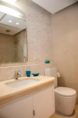 a bathroom with a sink and a toilet and a mirror at Unique Acropolis View in Athens
