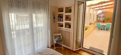 a mirror in a room with a room with a table at Oasis veranda under columns.Kolonaki embassy area. in Athens