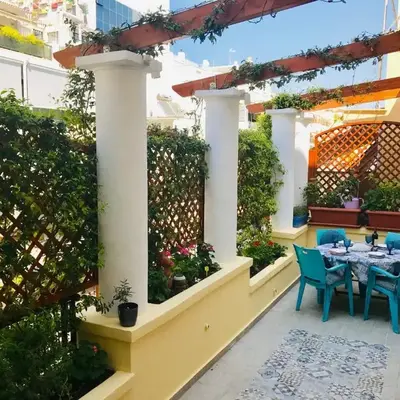 Oasis veranda under columns.Kolonaki embassy area.