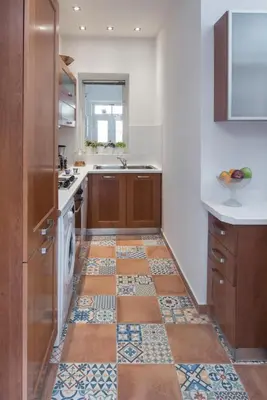 a kitchen with a tiled floor with a sink at Athenian House in Plaka Villa by Athenian Homes in Athens