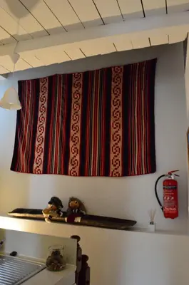 a curtain hanging on a wall in a room at Athenian House in Plaka Villa by Athenian Homes in Athens