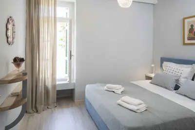 a bedroom with a bed with two towels on it at Athenian House in Plaka Villa by Athenian Homes in Athens