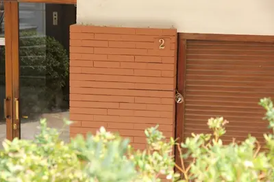 a brown garage door with the number two on it at Olga's Studio in Athens